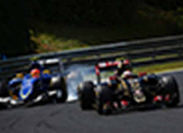 Blurry photo of Formula One cars